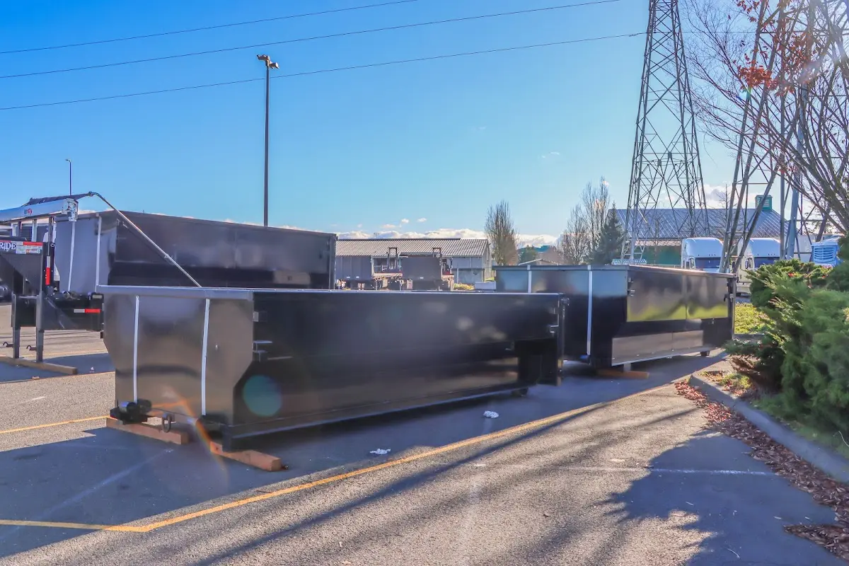 Roll-off dumpster ready for waste disposal at job site for 2 Yard Dumpster Rental in Eastmont